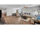 Spacious living room with modern ceiling fan, dining area, and comfortable seating at 3026 English Palmer Rd, North Las Vegas, NV 89086