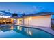 Backyard view showcasing pool, patio, and the home's exterior under a beautiful twilight sky at 3057 Downing Pl, Las Vegas, NV 89121