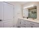 Bathroom features double sinks, white cabinets, and a modern mirror at 3057 Downing Pl, Las Vegas, NV 89121