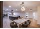 Modern dining area with marble table, pendant lighting, and open floor plan concept at 3057 Downing Pl, Las Vegas, NV 89121