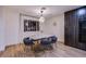 The dining area adjacent the kitchen has modern lighting and seating at 3057 Downing Pl, Las Vegas, NV 89121