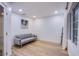 Comfortable living room with hardwood floors, a gray sofa, natural light and contemporary decor at 3057 Downing Pl, Las Vegas, NV 89121