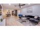 Open-concept living room flowing seamlessly into the modern kitchen with breakfast bar at 3057 Downing Pl, Las Vegas, NV 89121