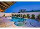 Backyard features a well-maintained pool and spa area, surrounded by mature landscaping and concrete deck for outdoor enjoyment at 3057 Downing Pl, Las Vegas, NV 89121