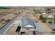 Rear aerial view of a brick home with solar panels on the roof at 3196 Mateuse St, Logandale, NV 89021