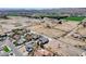 An aerial view showing this ranch style home with attached two car garage in a desert community at 3196 Mateuse St, Logandale, NV 89021