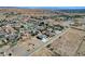 An aerial view showing this ranch style home with attached two car garage in a desert community at 3196 Mateuse St, Logandale, NV 89021