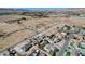 An aerial view showing this ranch style home with attached two car garage in a desert community at 3196 Mateuse St, Logandale, NV 89021