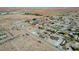 Birds eye view of residential area shows single-Gathering homes with desert landscaping and mountain scenery at 3196 Mateuse St, Logandale, NV 89021