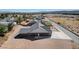 Aerial view of property featuring large driveway and back door at 3196 Mateuse St, Logandale, NV 89021