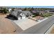 Stunning aerial view of a modern home boasting a spacious driveway, two-car garage, and drought-resistant landscaping at 3196 Mateuse St, Logandale, NV 89021