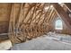 View of unfinished attic space with visible beams and light coming in at 3196 Mateuse St, Logandale, NV 89021