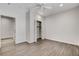 Bright bedroom features modern flooring, a closet, and a doorway to another carpeted room at 3196 Mateuse St, Logandale, NV 89021