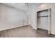 A bedroom featuring hardwood floors, ceiling fan, closet, and white trim at 3196 Mateuse St, Logandale, NV 89021