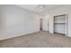 Bedroom features neutral carpet, ceiling fan and closet at 3196 Mateuse St, Logandale, NV 89021