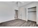 Bedroom with hardwood floors, closet, and white trim at 3196 Mateuse St, Logandale, NV 89021