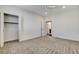 Bright bedroom with a closet, neutral carpet, and a doorway to an ensuite bathroom at 3196 Mateuse St, Logandale, NV 89021