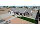 An exterior front view showing this ranch style home with attached two car garage and brick accents at 3196 Mateuse St, Logandale, NV 89021