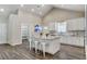 Bright kitchen island with bar stool seating, modern sink and stylish countertops at 3196 Mateuse St, Logandale, NV 89021