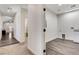 Spacious laundry room with cabinetry, utility sink, and modern flooring at 3196 Mateuse St, Logandale, NV 89021