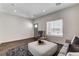 Bright living room with natural light, modern ottoman, neutral colors, and wood-look floors at 3196 Mateuse St, Logandale, NV 89021