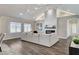 Bright living room with hardwood floors, a fireplace, and plenty of natural light at 3196 Mateuse St, Logandale, NV 89021