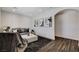 Well-lit living room with stylish decor, featuring an area rug, modern sofa, and sleek, modern accents at 3196 Mateuse St, Logandale, NV 89021