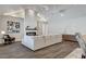 Open concept living room with wood floors and a fireplace at 3196 Mateuse St, Logandale, NV 89021