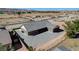 An aerial rear view showing landscaping and a concrete driveway at 3196 Mateuse St, Logandale, NV 89021