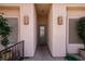 Welcoming front entrance with decorative sconces and wrought iron gate, creating a warm and inviting arrival at 328 Vineyard Ln, Mesquite, NV 89027