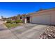 Low angle view of several attractive homes in a quiet neighborhood with well-maintained landscaping at 328 Vineyard Ln, Mesquite, NV 89027