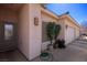 Charming facade with potted plants and sidelight windows by the front door and garage at 328 Vineyard Ln, Mesquite, NV 89027