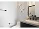 Contemporary bathroom with a black framed shower, stone countertop, modern fixtures, and decorative starfish accents at 333 Highview Ridge Ave, Las Vegas, NV 89138