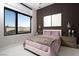 Stylish bedroom with a textured accent wall, large window, pendant lighting, and a plush bed with a fur throw at 333 Highview Ridge Ave, Las Vegas, NV 89138