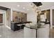 Stylish dining area with a bar, featuring a glass-top table and unique lighting fixture at 333 Highview Ridge Ave, Las Vegas, NV 89138