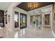 Contemporary foyer with glass-walled office, sleek marble floors, and modern lighting fixtures at 333 Highview Ridge Ave, Las Vegas, NV 89138