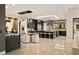 Luxury kitchen featuring a large island, modern lighting, and sleek, dark cabinetry at 333 Highview Ridge Ave, Las Vegas, NV 89138