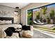 Main bedroom with sliding glass doors, a stylish ceiling fan and backyard access at 333 Highview Ridge Ave, Las Vegas, NV 89138