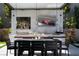 Outdoor kitchen with stainless steel appliances, a bar top, a dining table, and a television for entertainment at 333 Highview Ridge Ave, Las Vegas, NV 89138