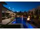 A luxurious pool and patio area with integrated lighting and outdoor seating at 333 Highview Ridge Ave, Las Vegas, NV 89138