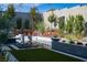 Inviting pool area features a water feature, vibrant landscaping, and modern seating at 333 Highview Ridge Ave, Las Vegas, NV 89138