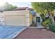 Exterior of a two-story home with a two car garage and a low maintenance front yard at 3339 Duece St, Las Vegas, NV 89121