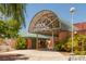 Outdoor pool entrance with clear signage, mature landscaping and shaded entrance at 3505 Tuscany Village Dr, Las Vegas, NV 89129