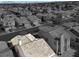 Monochrome aerial view of desert homes and mountains, providing an overview of the neighborhood at 3505 Tuscany Village Dr, Las Vegas, NV 89129