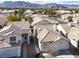 Desert homes with tile roofs creates an inviting neighborhood scene set against a majestic mountain backdrop at 3505 Tuscany Village Dr, Las Vegas, NV 89129
