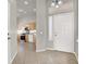 Inviting entryway view into the kitchen featuring ample cabinet space and modern appliances at 3505 Tuscany Village Dr, Las Vegas, NV 89129