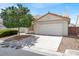 Charming single-story home featuring a two-car garage and xeriscaping, plus a manicured lawn at 3505 Tuscany Village Dr, Las Vegas, NV 89129
