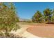 Scenic golf course view with lush green fairways, mature trees, and distant mountain views, offering a serene backdrop at 3505 Tuscany Village Dr, Las Vegas, NV 89129