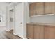 Hallway features wood floors, storage cabinets, and an entrance to another room at 3505 Tuscany Village Dr, Las Vegas, NV 89129