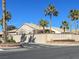 Tuscany Village entrance showcases a desert landscape with palm trees and a neutral-toned facade at 3505 Tuscany Village Dr, Las Vegas, NV 89129